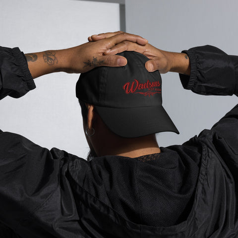 Black hat with red writing saying Wadson's Hot Rods with red pin stripping under 